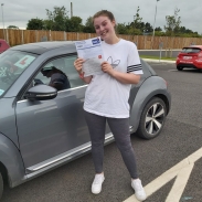 Ella Courtney posing with PASS certificate