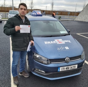 Marcos Puozzo posing with PASS certificate